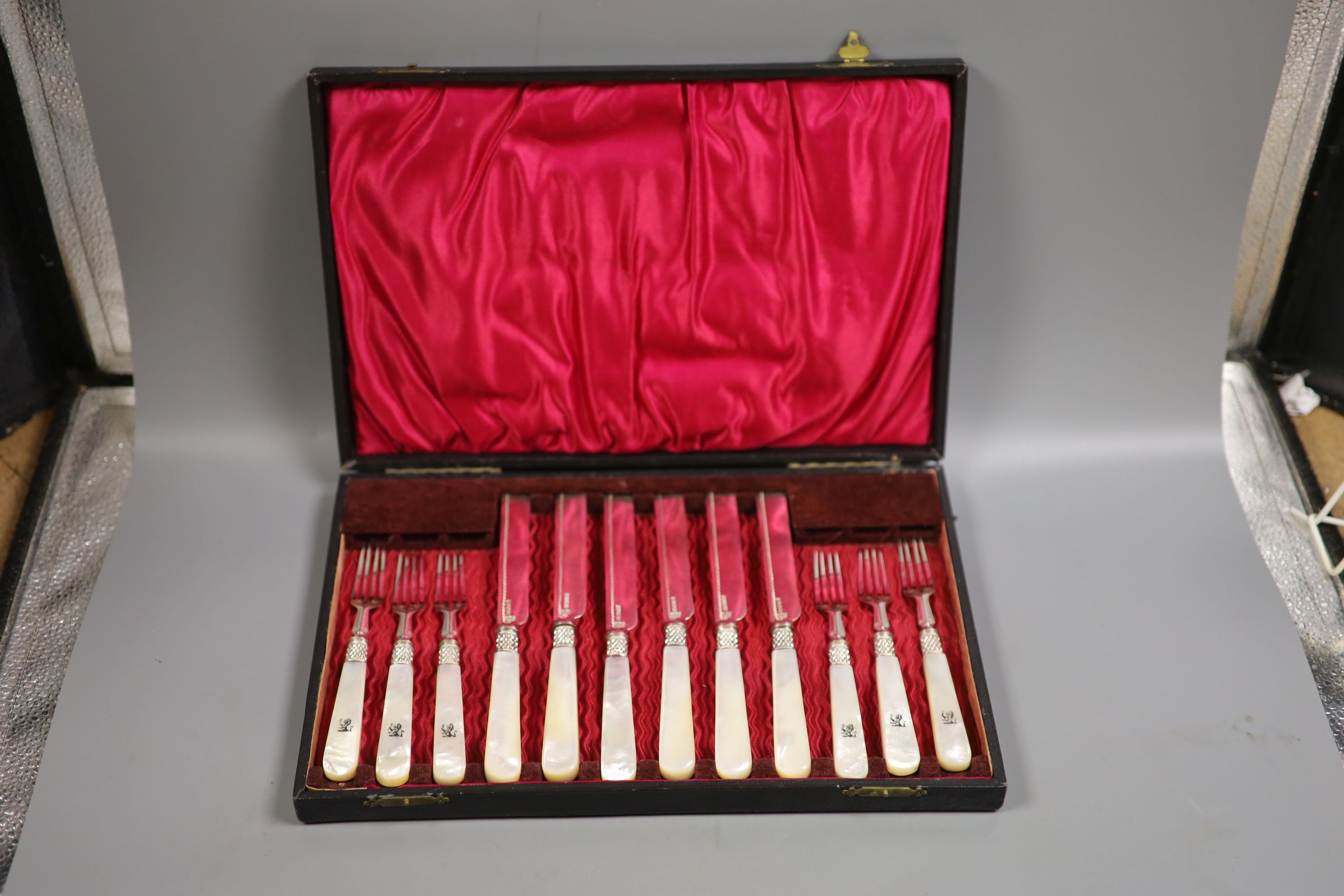 A cased set of six pairs of mother of pearl handled dessert eaters, Mappin & Webb, Sheffield, 1880, case 34cm.